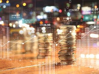 pile of coins and financial graphs